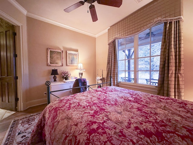 bedroom with crown molding and ceiling fan