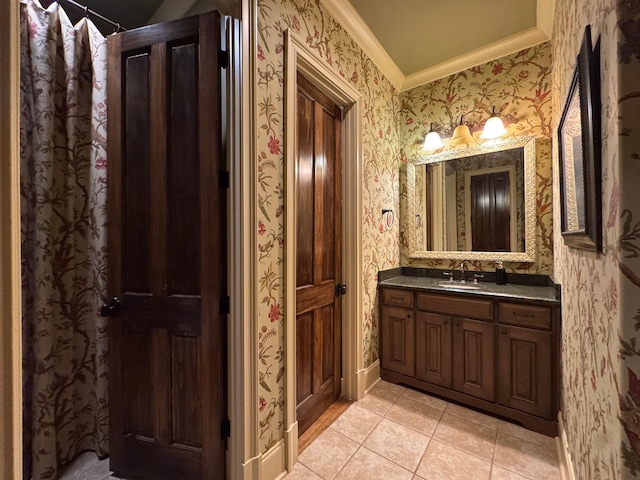 bathroom with vanity, ornamental molding, and tile patterned floors