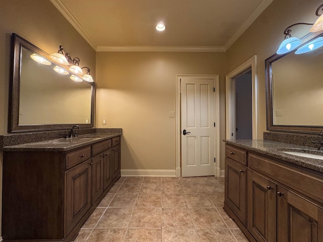 bathroom with crown molding, vanity, and tile patterned floors