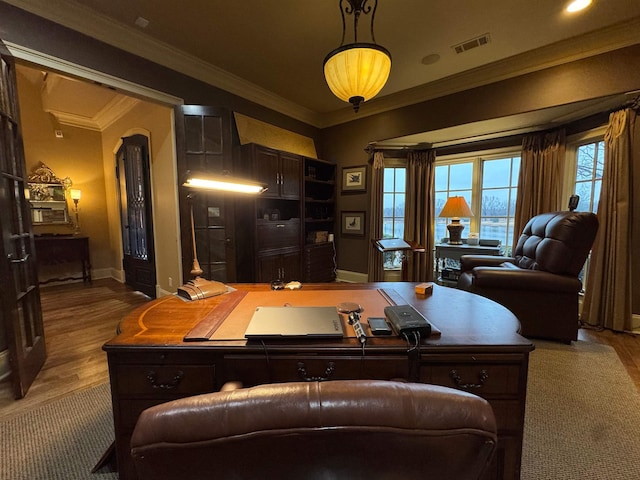 office with hardwood / wood-style flooring and crown molding