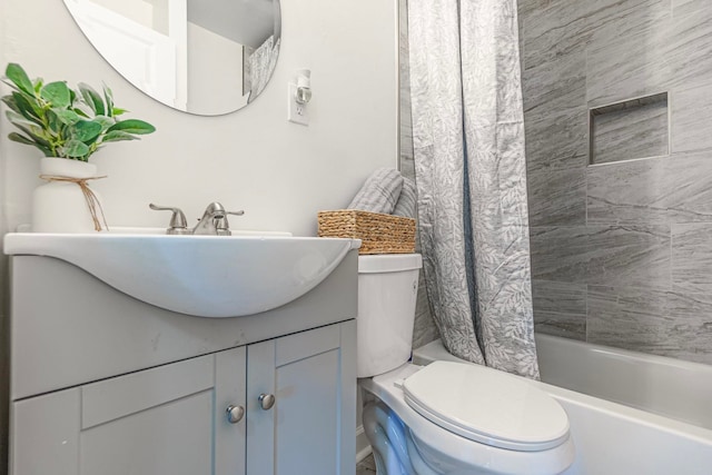 full bathroom featuring vanity, shower / bath combo, and toilet