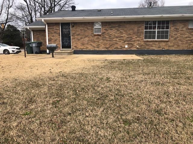 exterior space with a front yard