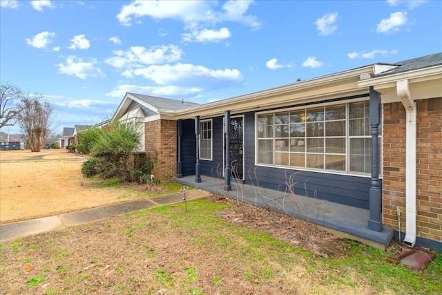 view of property exterior with a yard