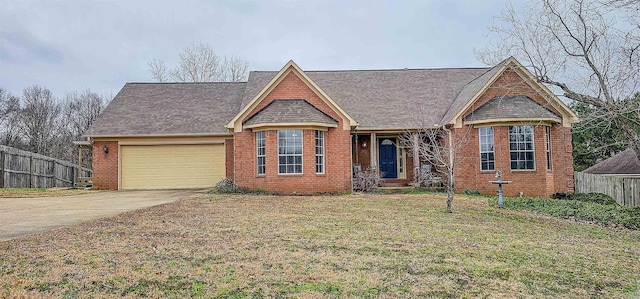 view of front of house with a garage and a front yard