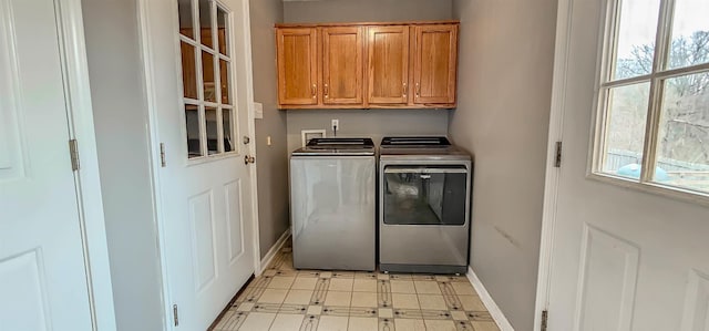 laundry area featuring cabinets and washer and dryer