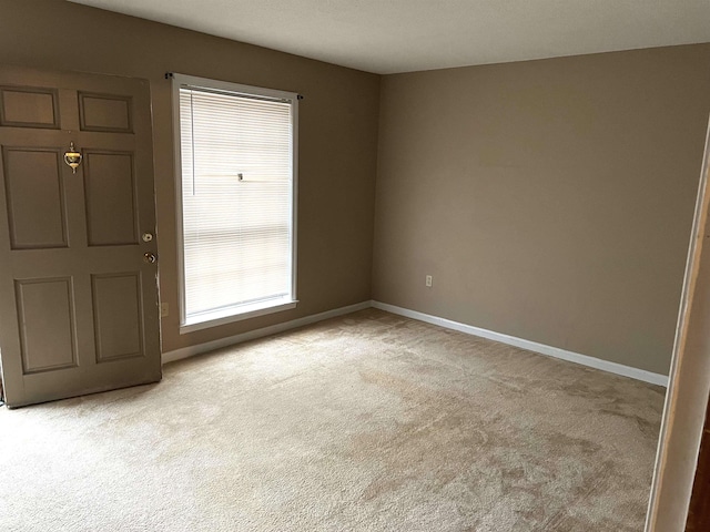 entrance foyer featuring light carpet