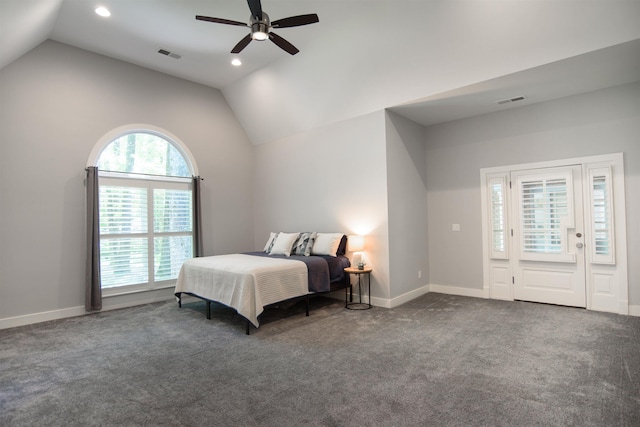 carpeted bedroom with vaulted ceiling and ceiling fan