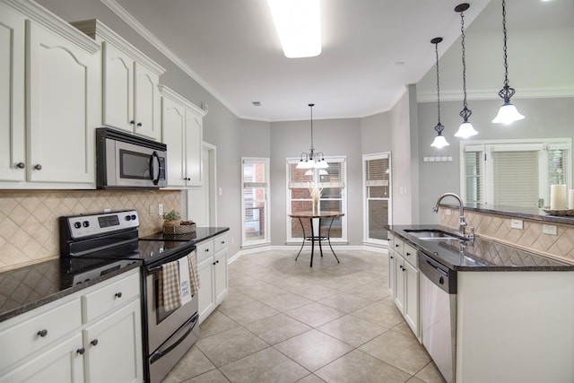 kitchen with white cabinetry, appliances with stainless steel finishes, sink, and pendant lighting