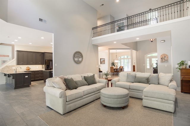 living room featuring a towering ceiling