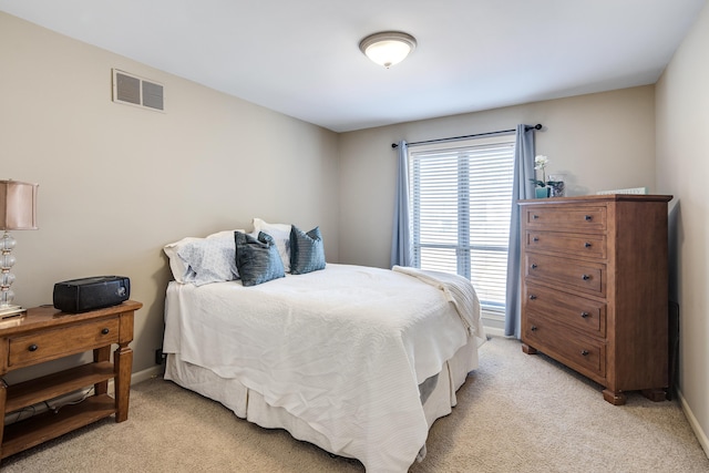 bedroom with light carpet