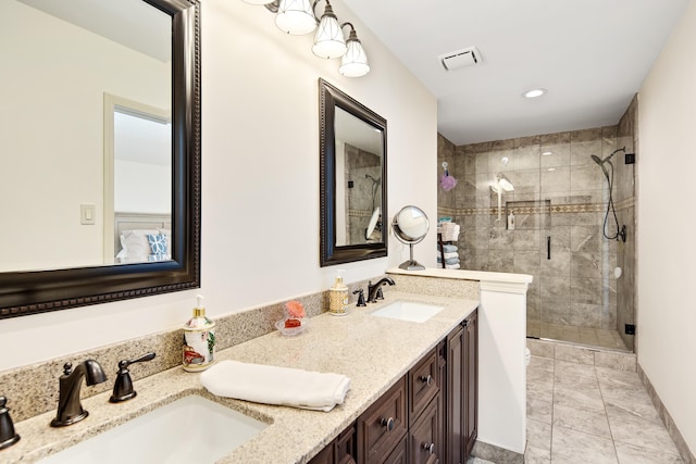 bathroom featuring vanity and an enclosed shower