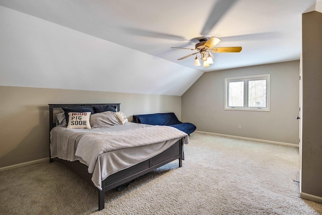 carpeted bedroom featuring ceiling fan and vaulted ceiling