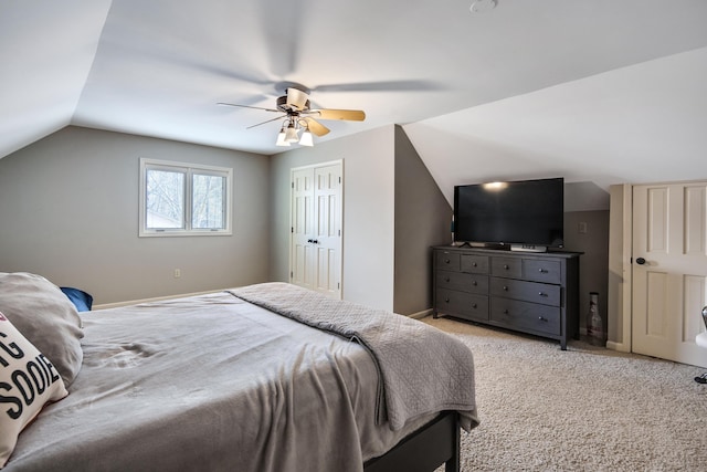 carpeted bedroom featuring vaulted ceiling and ceiling fan