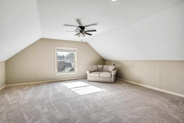 bonus room featuring ceiling fan, light colored carpet, and vaulted ceiling