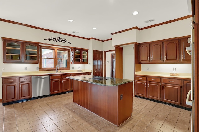 kitchen with sink, crown molding, dishwasher, a kitchen island, and dark stone counters