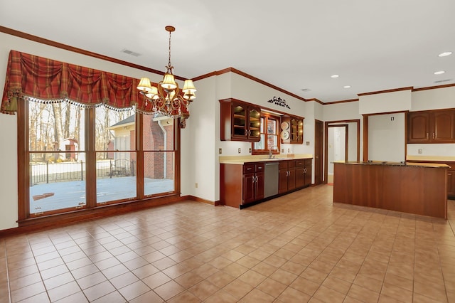 kitchen featuring pendant lighting, ornamental molding, dishwasher, and a notable chandelier