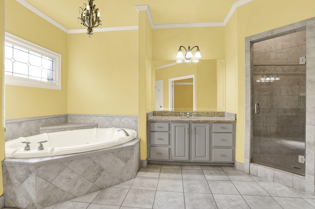 bathroom with ornamental molding, vanity, a notable chandelier, plus walk in shower, and tile patterned flooring