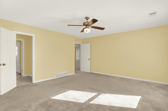 unfurnished room with light carpet and ceiling fan