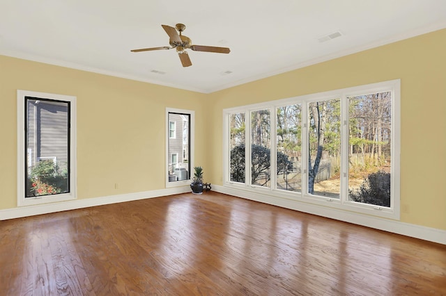 unfurnished room featuring crown molding, ceiling fan, and hardwood / wood-style flooring