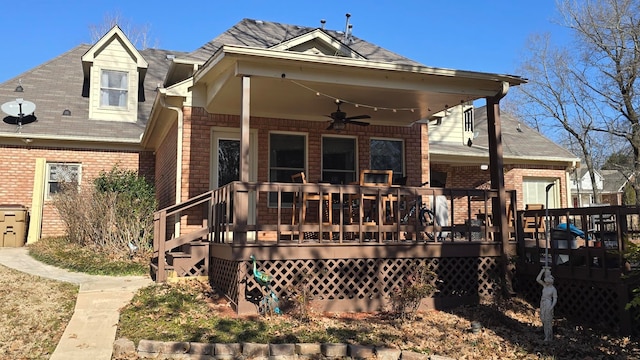 rear view of house with ceiling fan and a deck