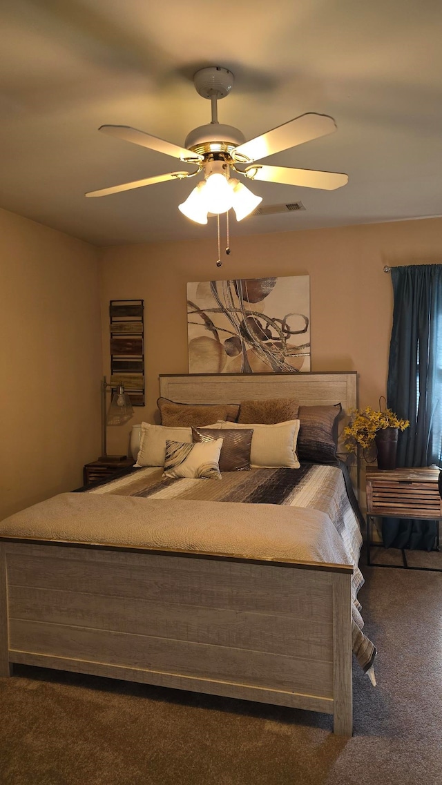 bedroom featuring ceiling fan and dark colored carpet