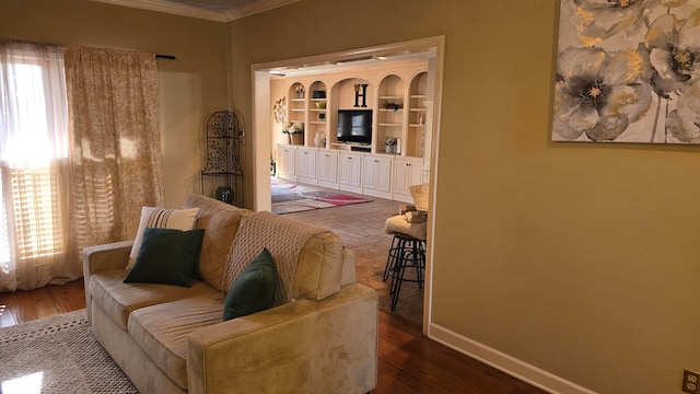 living room featuring a wealth of natural light, ornamental molding, and dark hardwood / wood-style floors