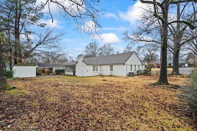 rear view of property featuring central AC unit