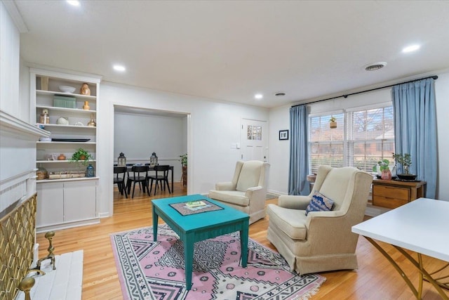 living room with light hardwood / wood-style floors