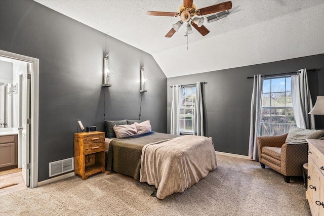 bedroom with connected bathroom, lofted ceiling, ceiling fan, light carpet, and a textured ceiling