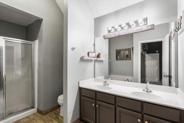 bathroom featuring vanity, toilet, an enclosed shower, and hardwood / wood-style floors