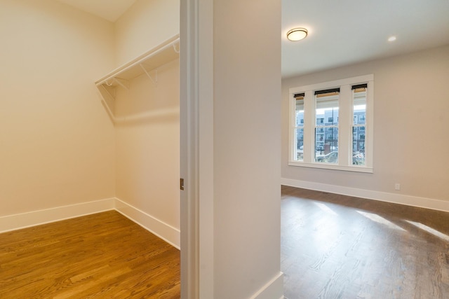 walk in closet featuring hardwood / wood-style floors