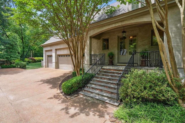 view of front of house featuring a garage and a porch