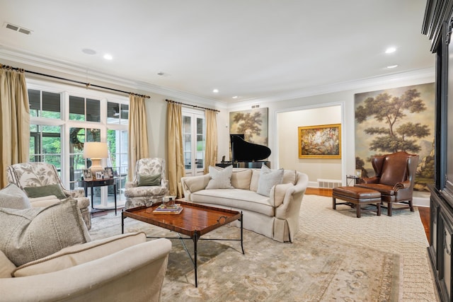 living room featuring ornamental molding and light wood-type flooring