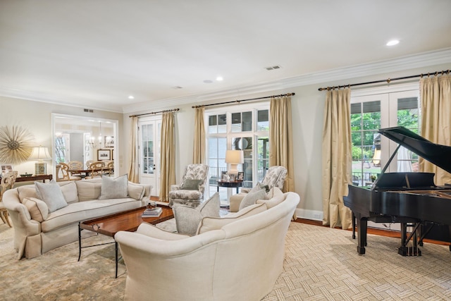 living room featuring crown molding and a chandelier