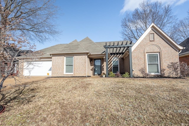 view of front of house featuring a garage and a front lawn