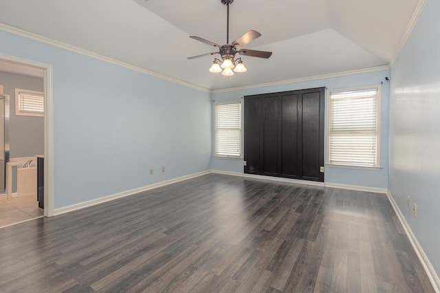 unfurnished room with ceiling fan, ornamental molding, dark hardwood / wood-style flooring, and a wealth of natural light