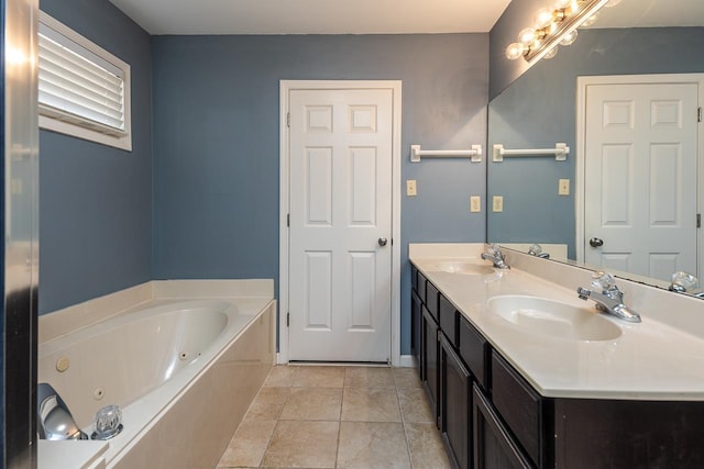 bathroom with vanity, a tub to relax in, and tile patterned flooring