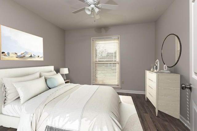 bedroom featuring ceiling fan and dark hardwood / wood-style flooring