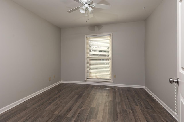 empty room with dark wood-type flooring and ceiling fan