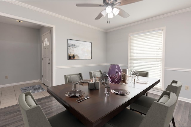 dining area with ceiling fan, ornamental molding, and dark hardwood / wood-style floors