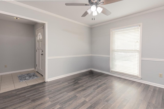 spare room featuring crown molding, ceiling fan, and dark hardwood / wood-style flooring