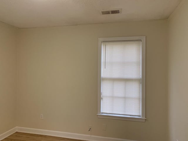 spare room with light hardwood / wood-style floors