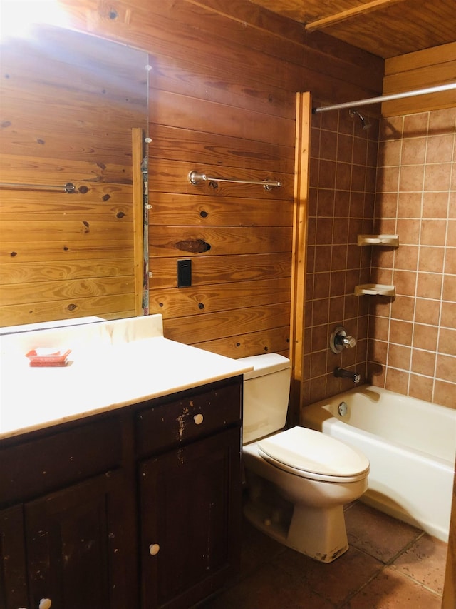 bathroom with washtub / shower combination, wood walls, vanity, and toilet