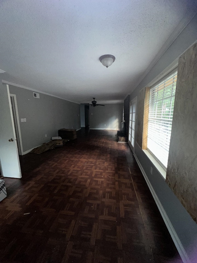 corridor with dark parquet floors and a textured ceiling