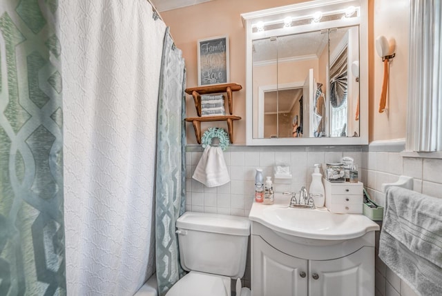 bathroom with toilet, crown molding, a shower with curtain, tile walls, and vanity