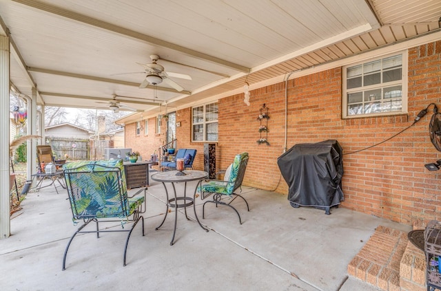 view of patio with a grill and ceiling fan