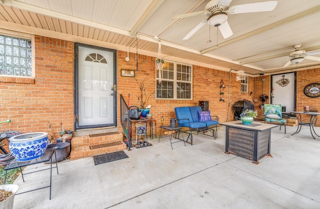 property entrance with an outdoor hangout area, ceiling fan, and a patio area