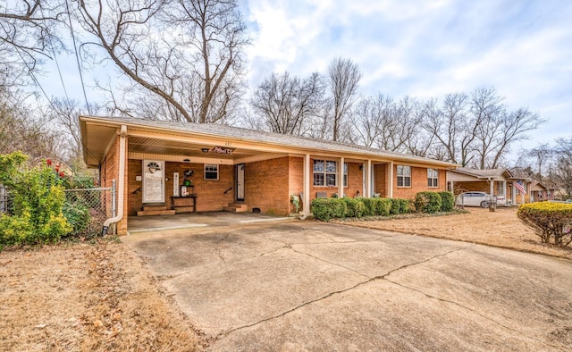 ranch-style house with a carport