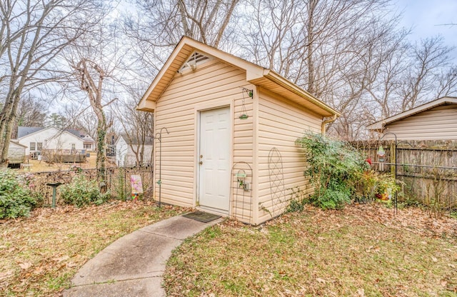 view of outbuilding with a lawn