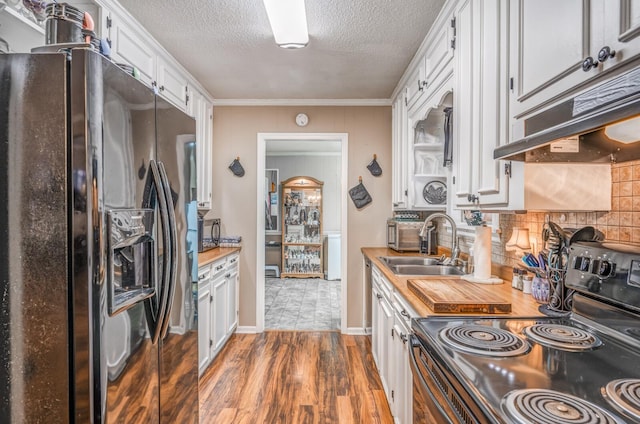 kitchen with white cabinetry, dark hardwood / wood-style floors, wood counters, and black appliances